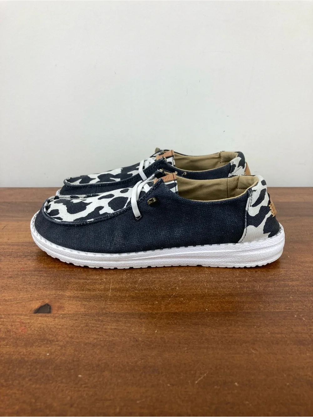 Hey Dude Wendy Animal Black Cow Print Slip-On Shoes 41037-0HO Women's Size 6.